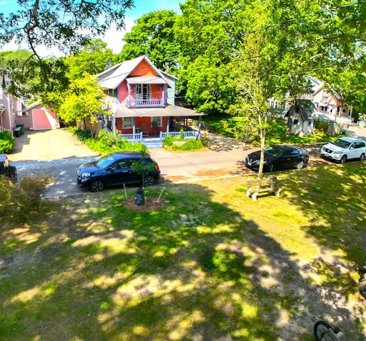 a front view of a house with a yard table and chairs