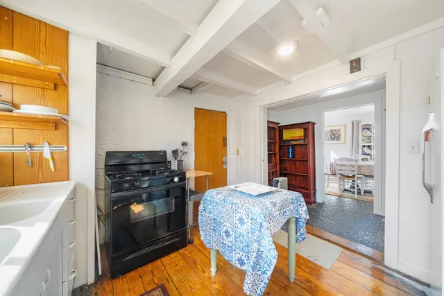 a kitchen with stainless steel appliances granite countertop a stove and a refrigerator