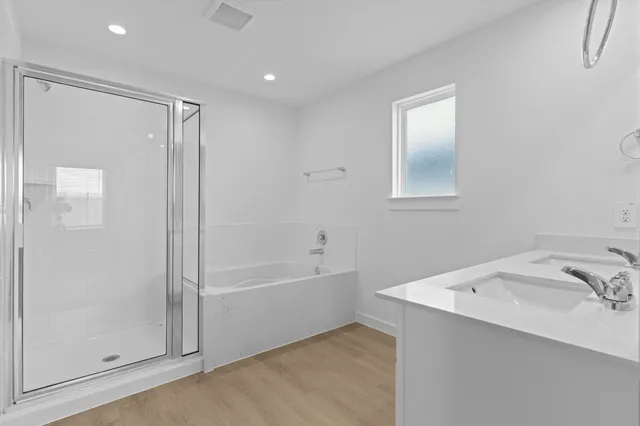 a bathroom with a bathtub and a sink