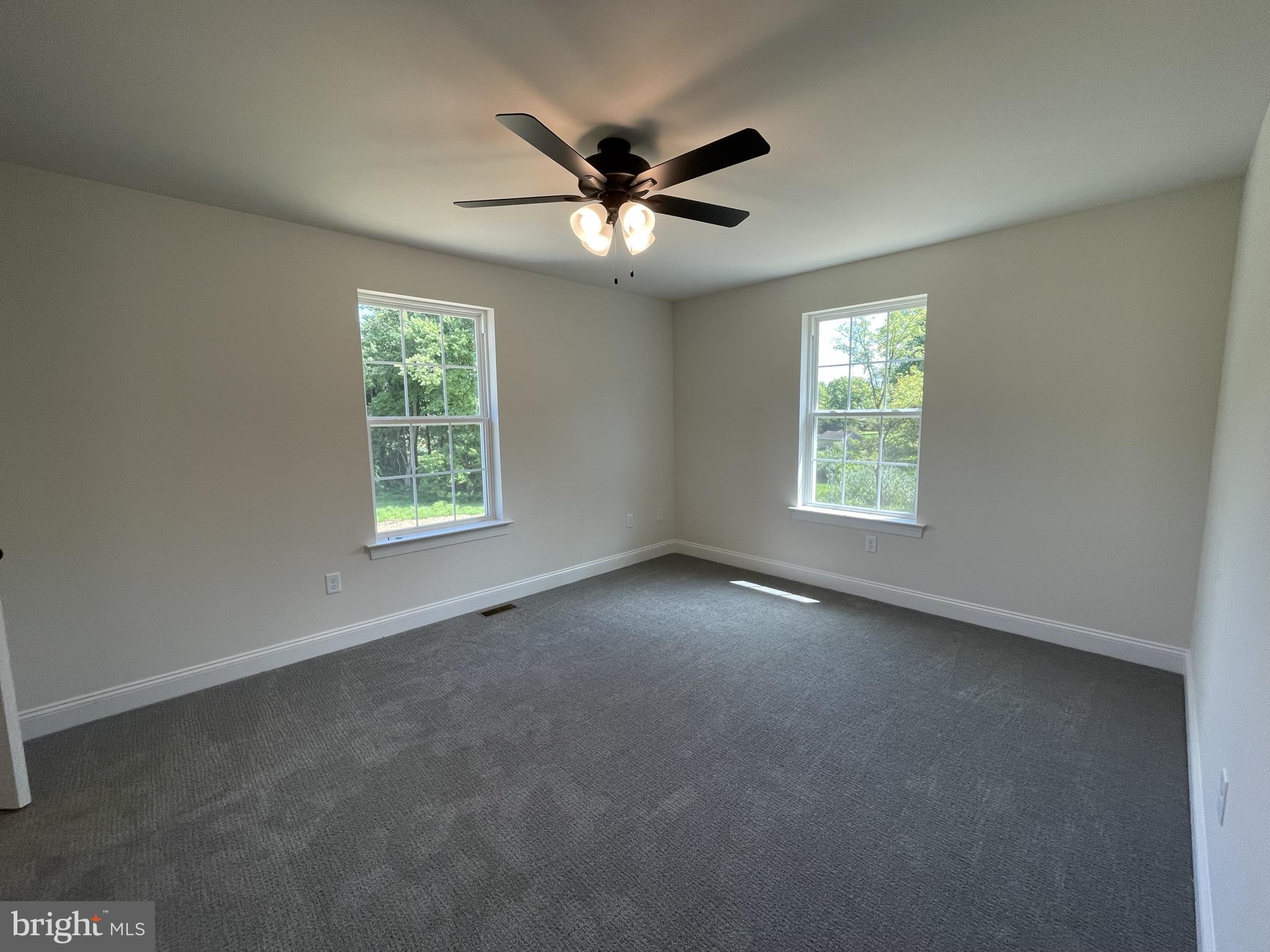 10 Hidden Pond Drive Reading, PA 19607 - Photo 20 of 23 an empty room with a window and a ceiling fan
