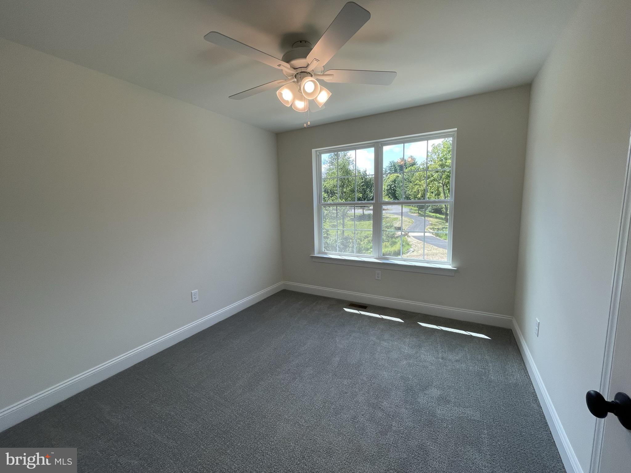 10 Hidden Pond Drive Reading, PA 19607 - Photo 22 of 23 an empty room with a window and a fan