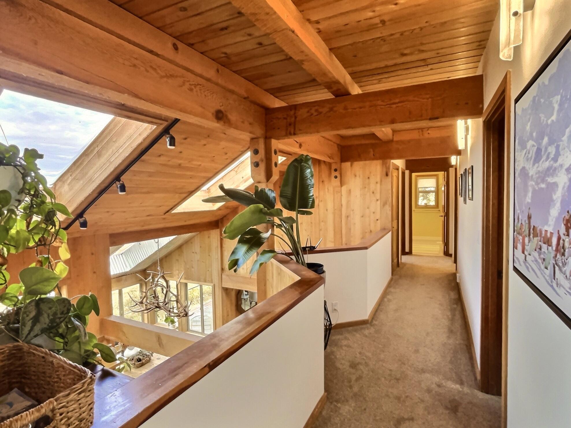 60359 Arnold Market Road Bend, OR 97702 - Photo 39 of 64 upstairs hallway, overlooking kitchen area and skylights