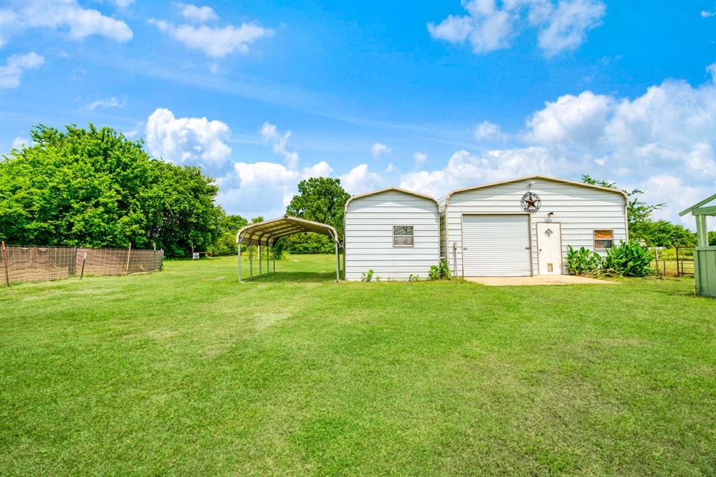 735 1st Southwest Detroit, TX 75436 - Photo 16 of 26 a view of a house with a backyard
