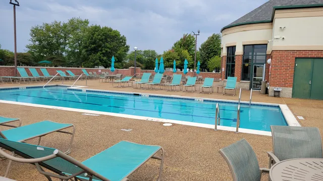 a view of a swimming pool with a lounge chair