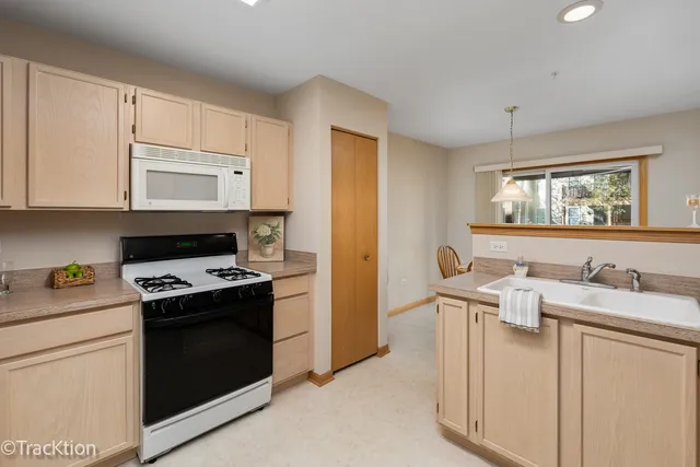 a kitchen with a sink stove and refrigerator