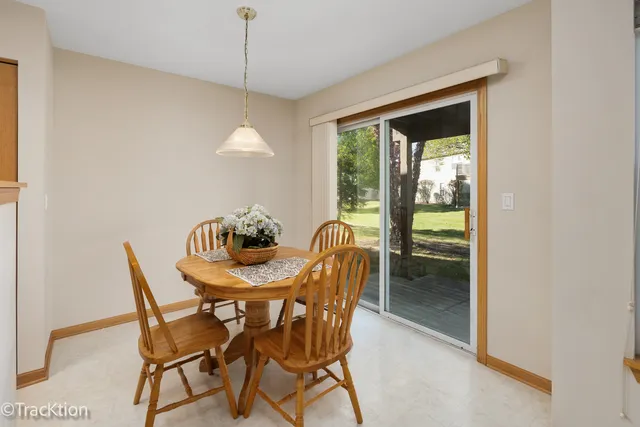 a dining room with furniture and window