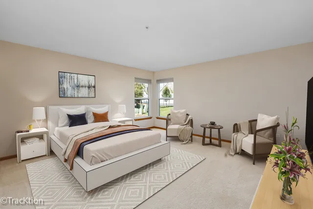 a bedroom with bed and a couch