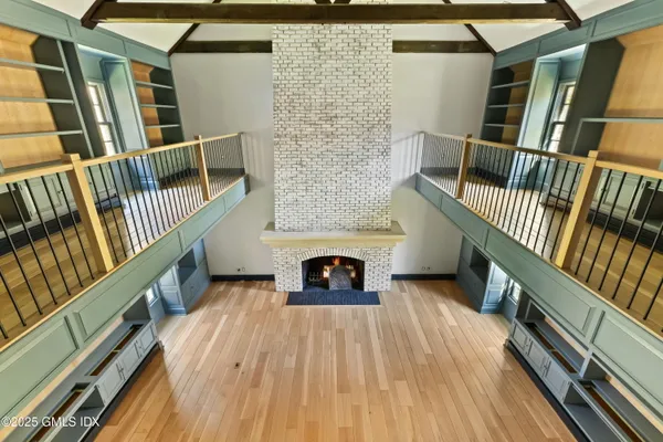 a view of an entryway with wooden floor