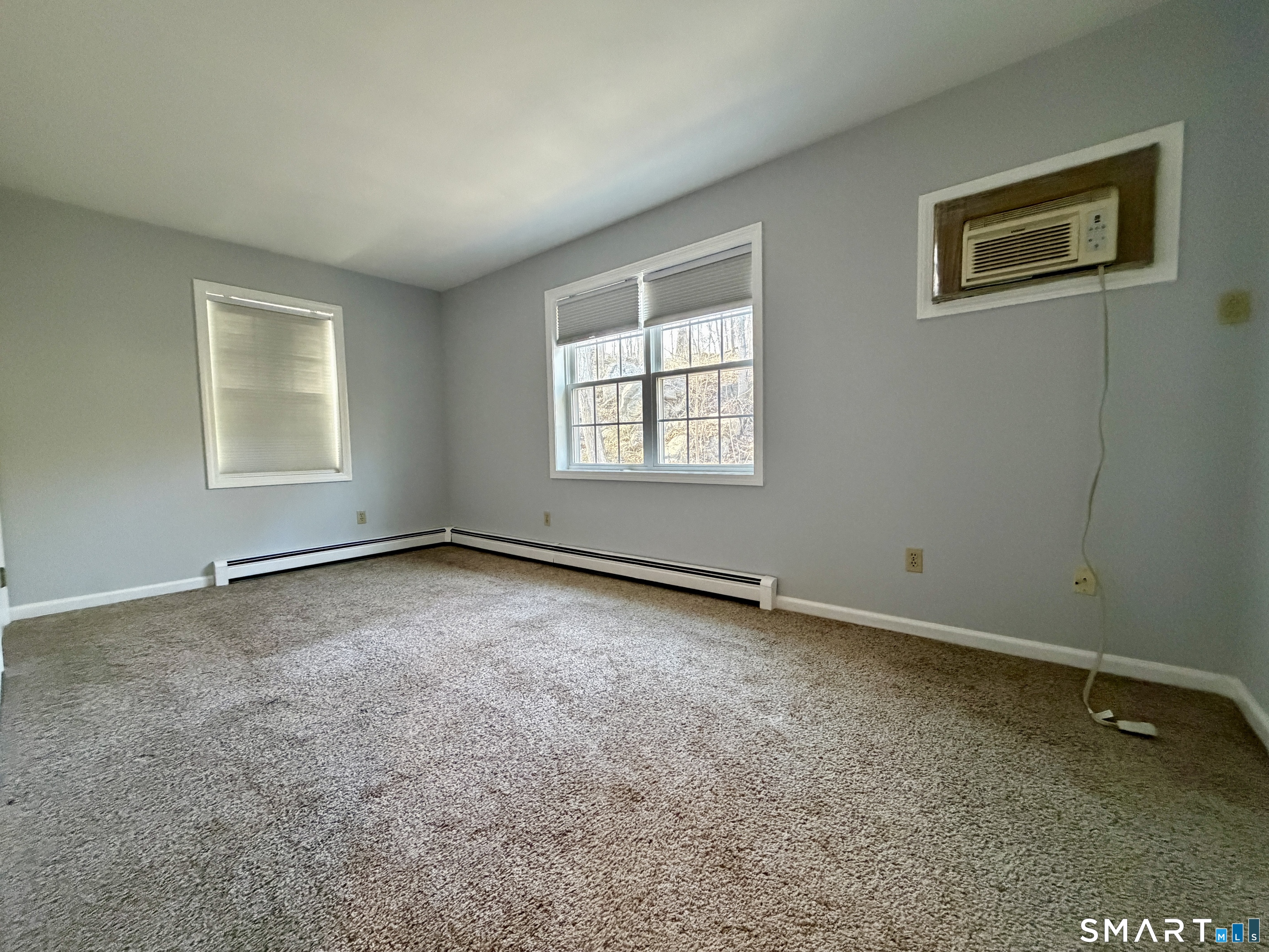 154 East Main Street, Unit A Branford, CT 06405 - Photo 11 of 17 an empty room with a window