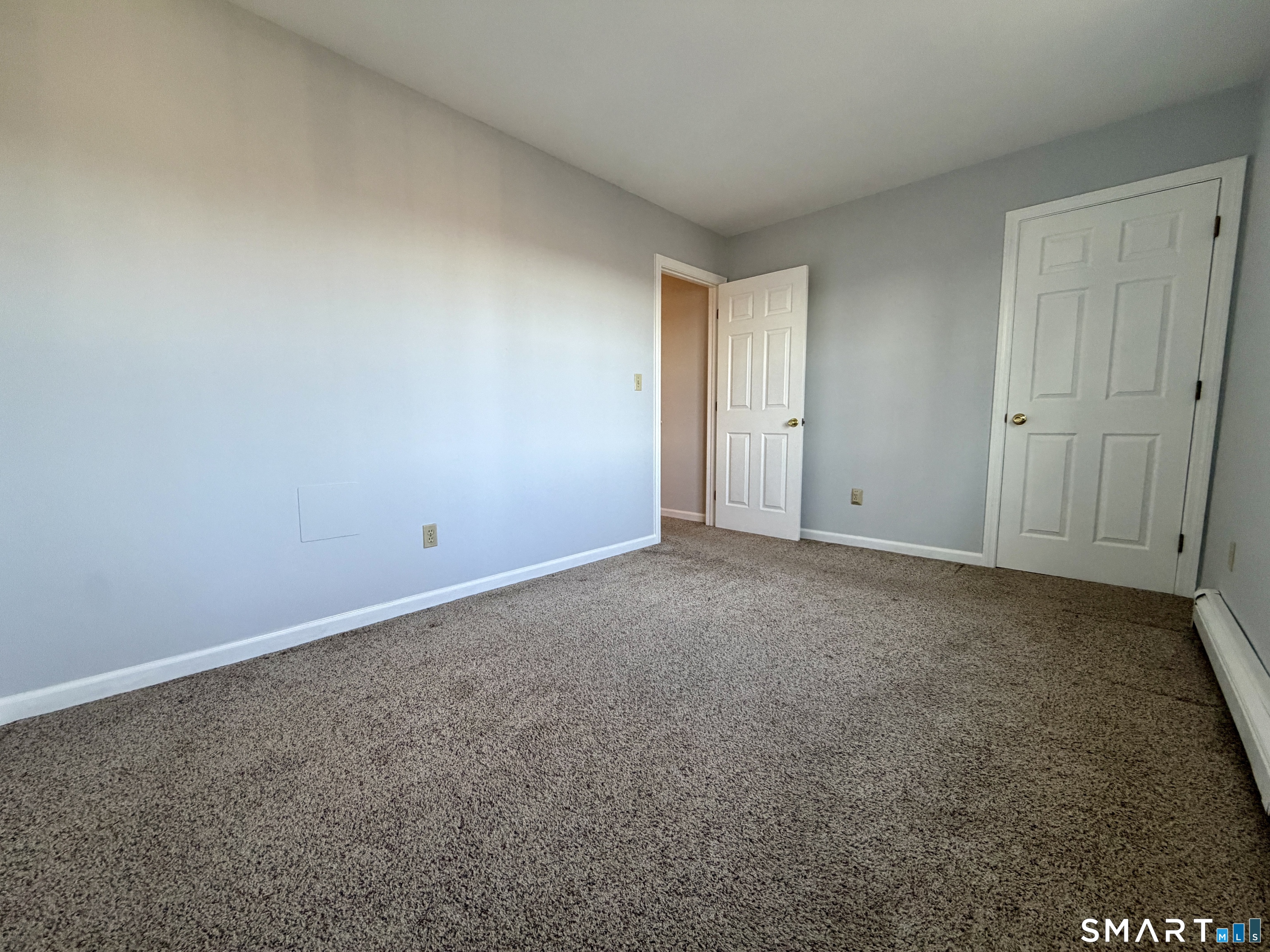 154 East Main Street, Unit A Branford, CT 06405 - Photo 12 of 17 a view of an empty room and closet