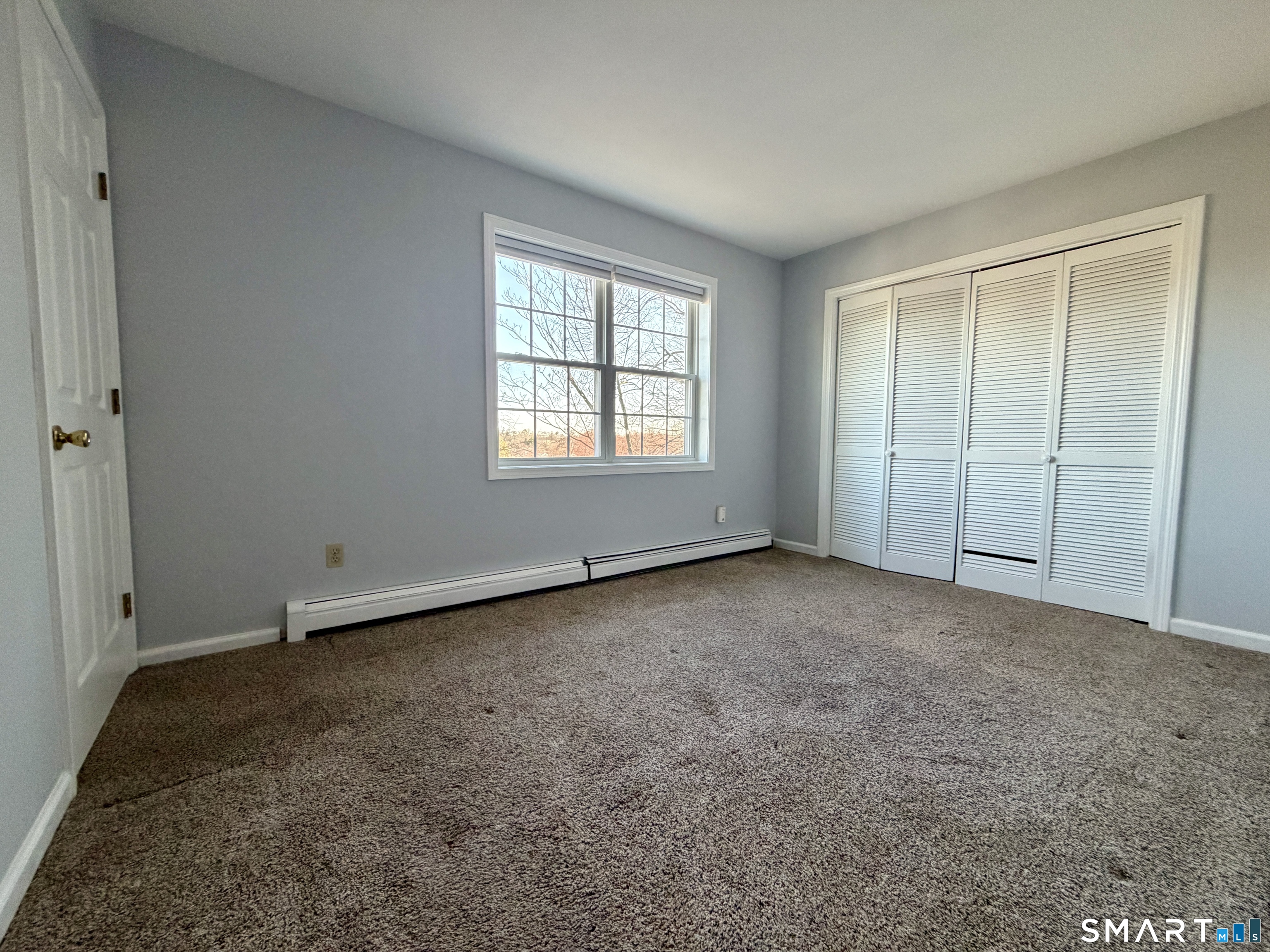 154 East Main Street, Unit A Branford, CT 06405 - Photo 13 of 17 an empty room with a empty space and windows