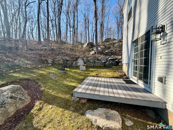 a view of a backyard with swimming pool
