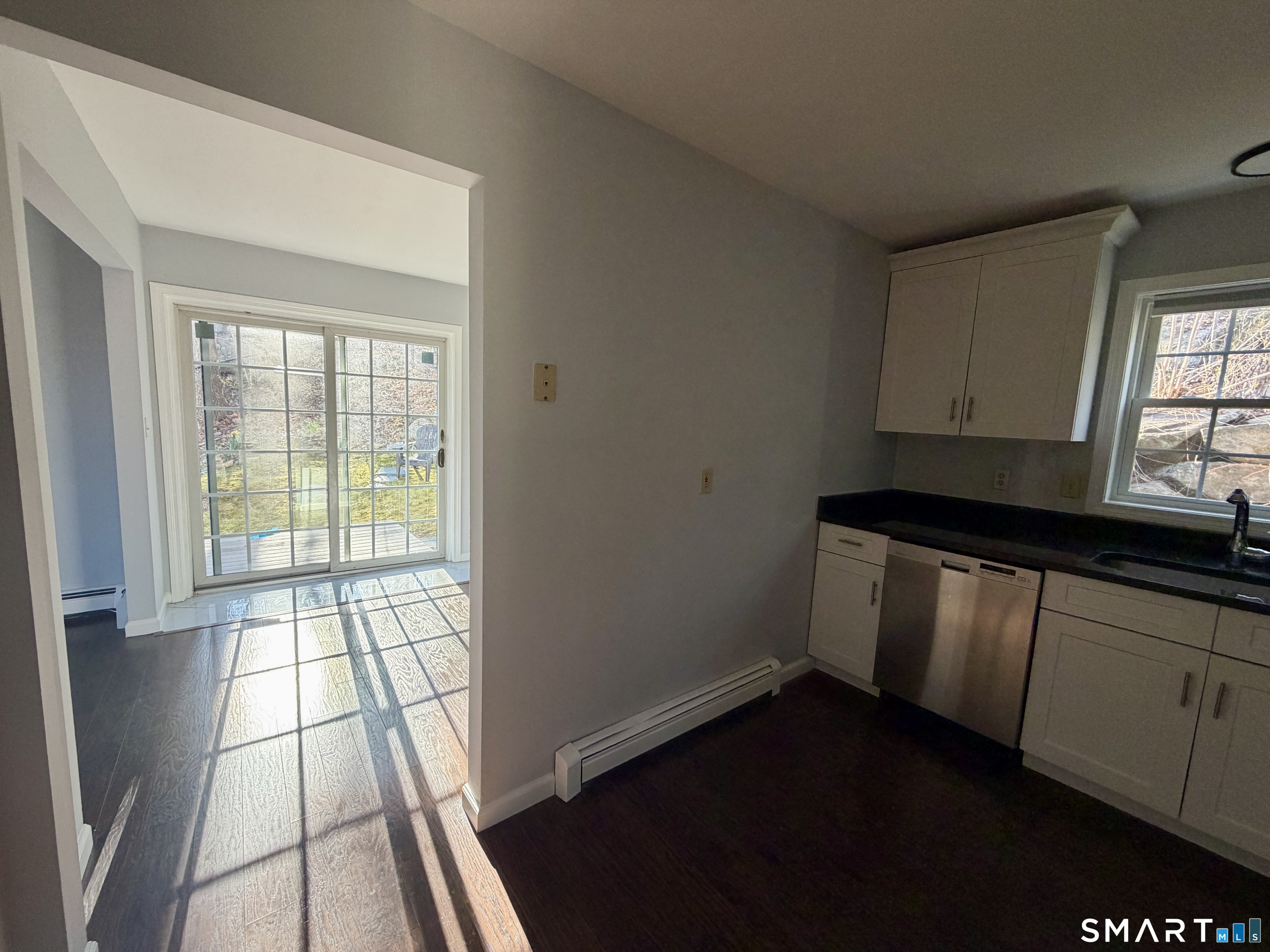 154 East Main Street, Unit A Branford, CT 06405 - Photo 3 of 17 a view of an empty room with a window