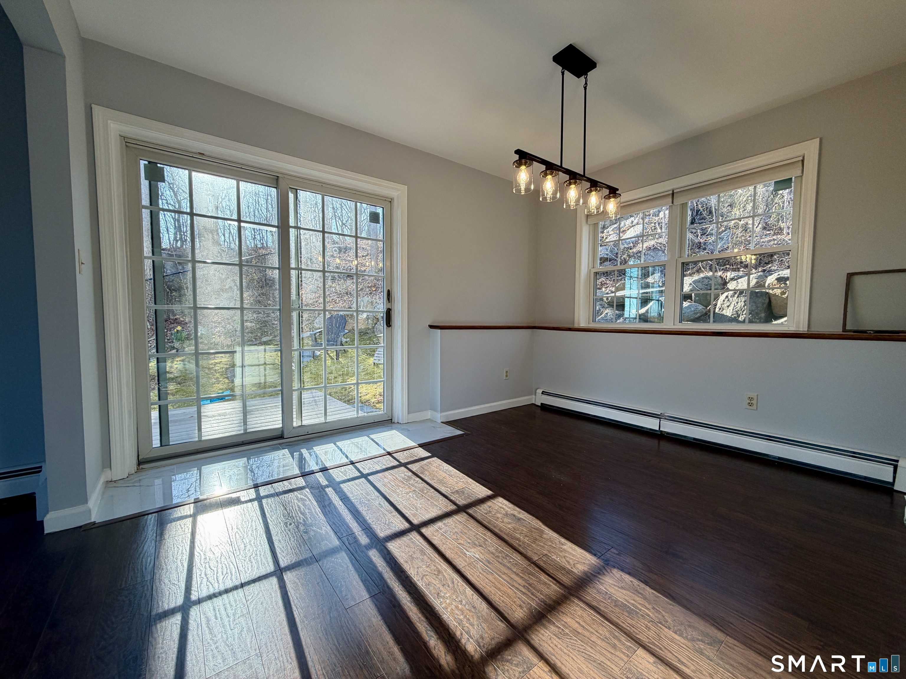154 East Main Street, Unit A Branford, CT 06405 - Photo 5 of 17 a view of empty room with wooden floor and fan