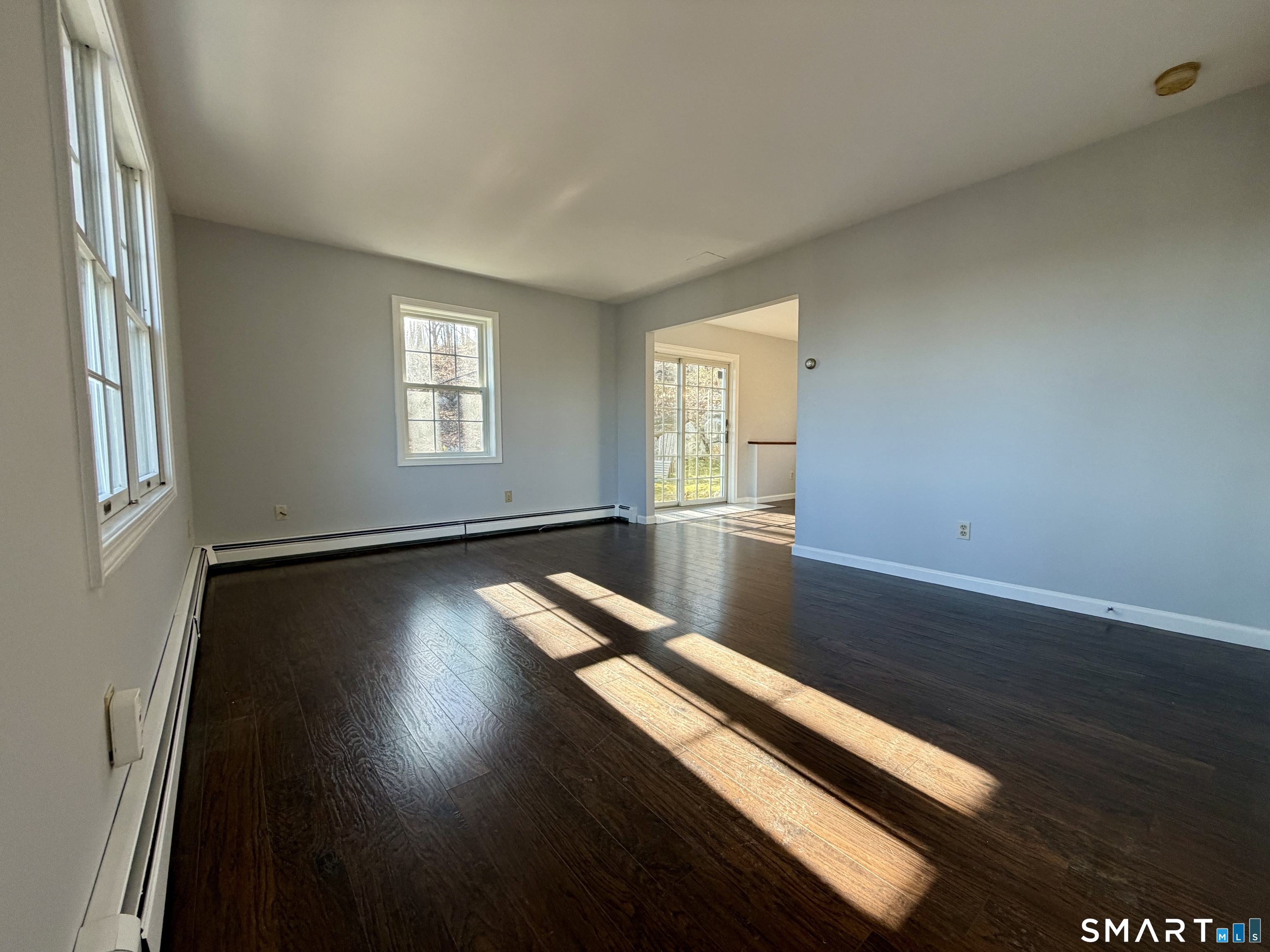 154 East Main Street, Unit A Branford, CT 06405 - Photo 8 of 17 a view of room with window and wooden floor