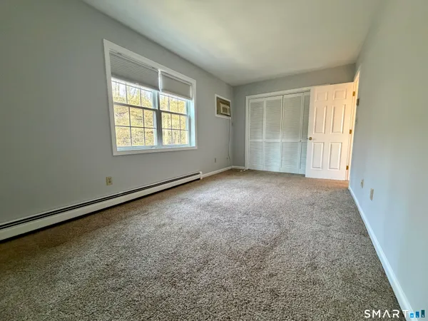an empty room with a empty space and a window