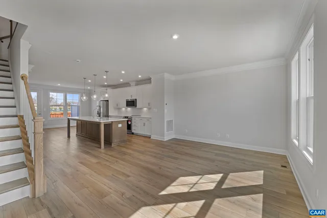 a view of kitchen and dining room with wooden floor