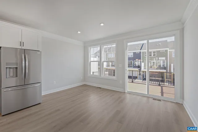a bathroom with a sink a toilet and a large mirror