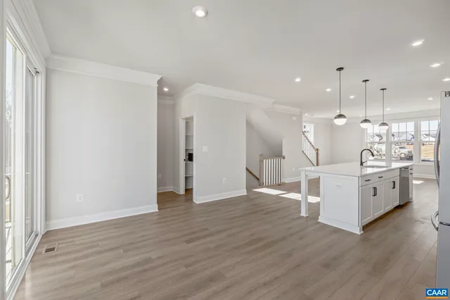 a view of an empty room and closet area