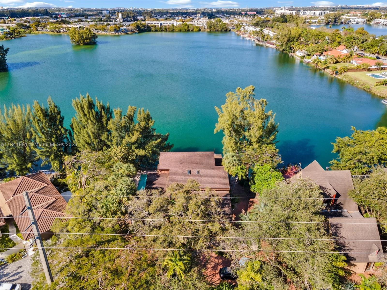 7261 Miller Drive Miami, FL 33155 - Photo 4 of 11 an aerial view of a houses with a lake view
