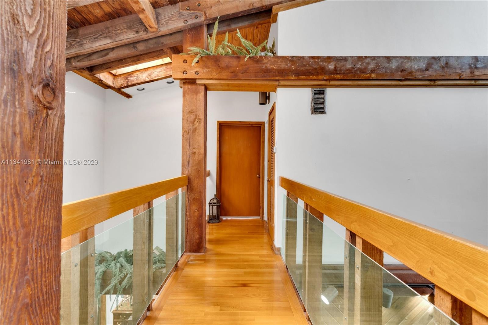 7261 Miller Drive Miami, FL 33155 - Photo 10 of 11 a view of a balcony with wooden floor