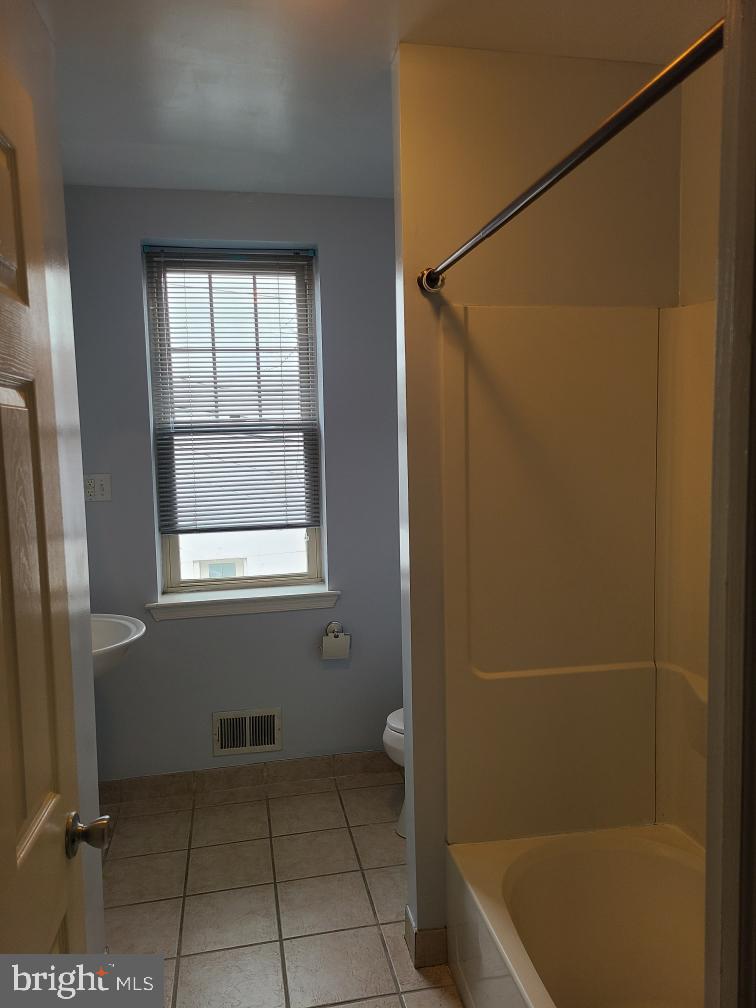 1918 Poplar Street, Unit 2 Philadelphia, PA 19130 - Photo 11 of 18 Bathroom on 2nd floor between kitchen & Bedroom