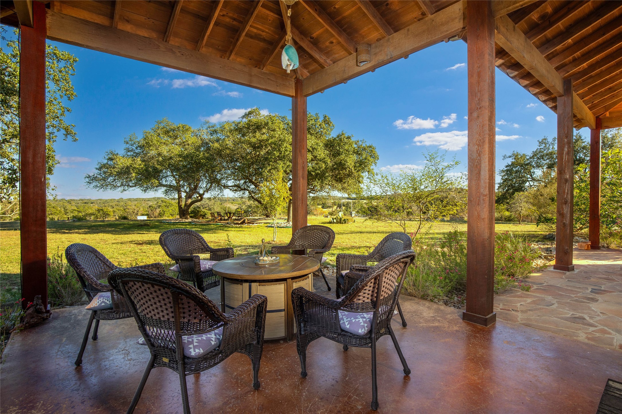 5059 Trainer Wuest Road Blanco, TX 78606 - Photo 23 of 39 a view of an outdoor dining space with furniture and wooden floor