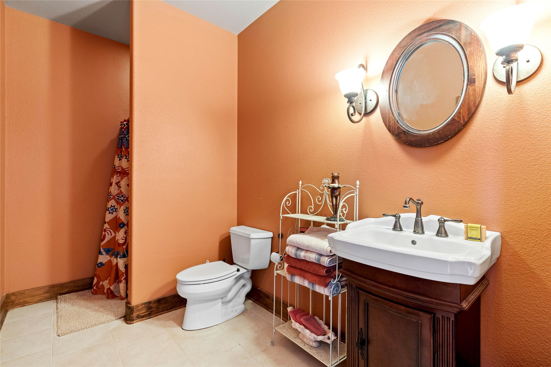5059 Trainer Wuest Road Blanco, TX 78606 - Photo 28 of 39 a bathroom with a toilet a sink and a mirror