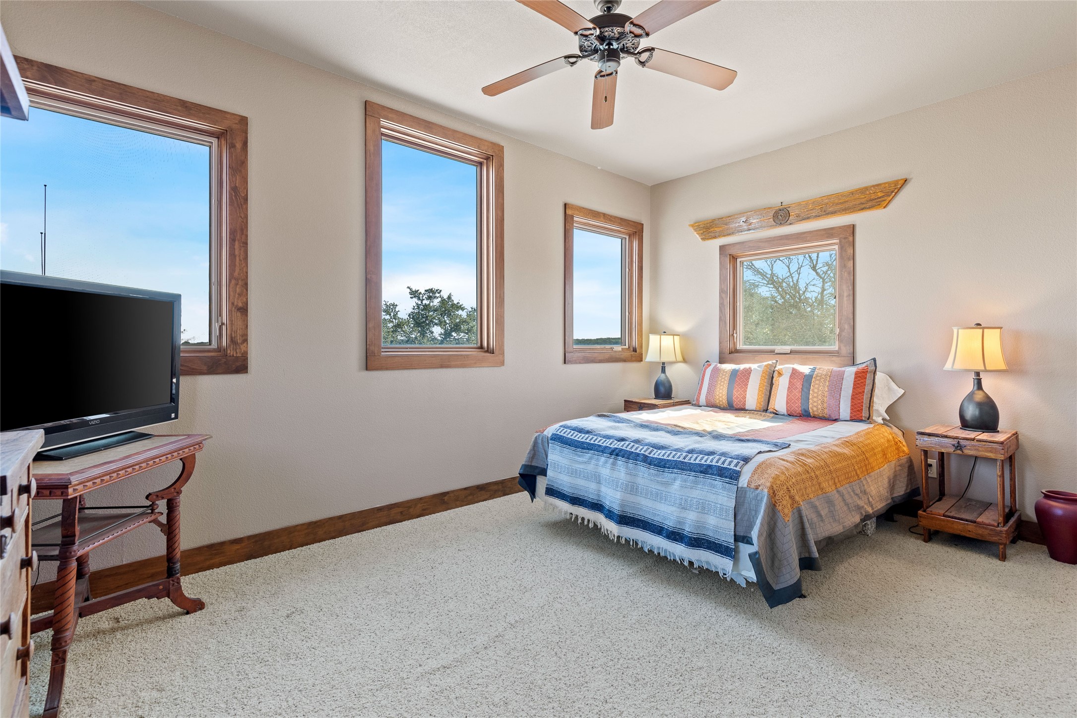5059 Trainer Wuest Road Blanco, TX 78606 - Photo 29 of 39 a bedroom with a bed and a flat screen tv