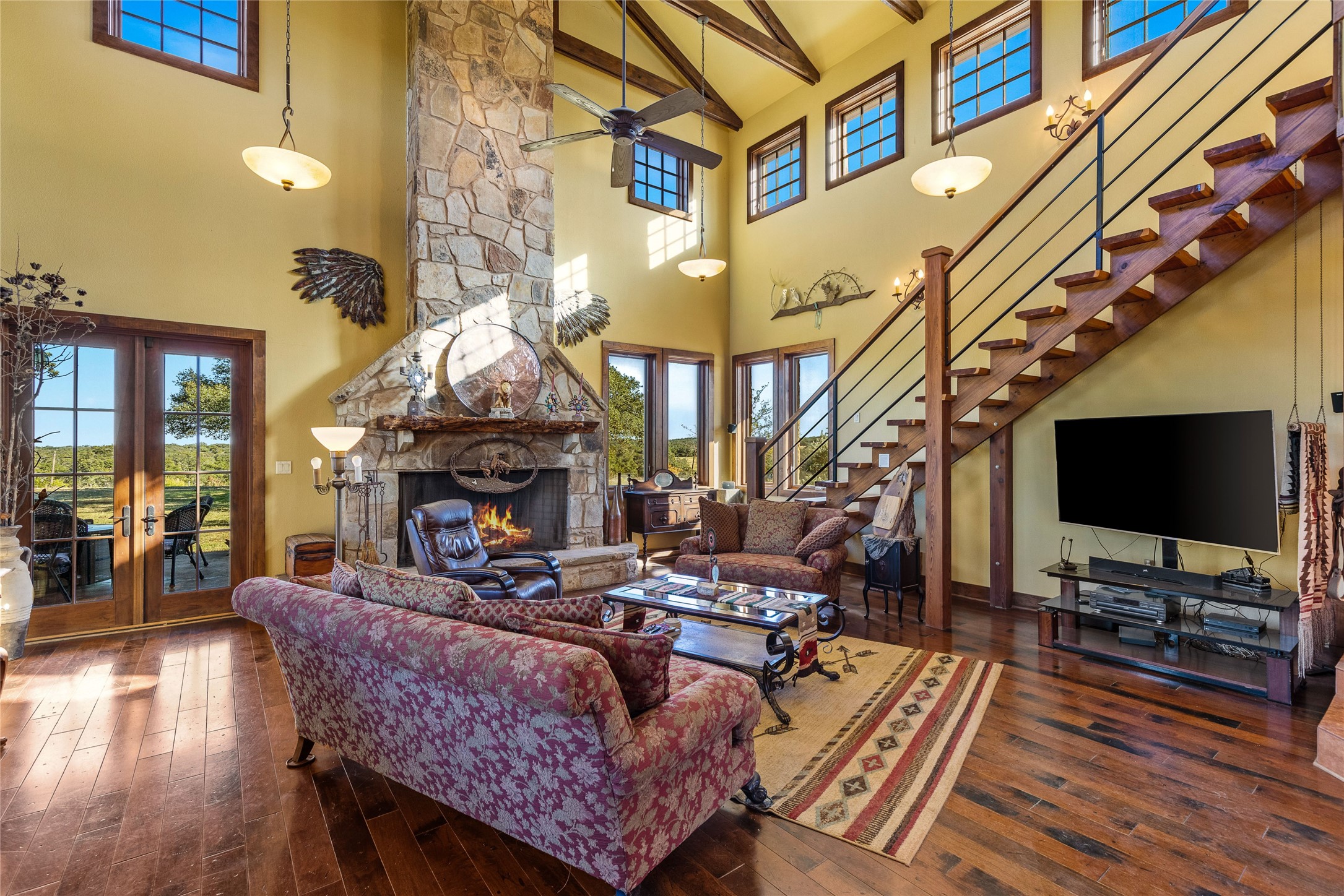 5059 Trainer Wuest Road Blanco, TX 78606 - Photo 6 of 39 a living room with fireplace furniture and a flat screen tv