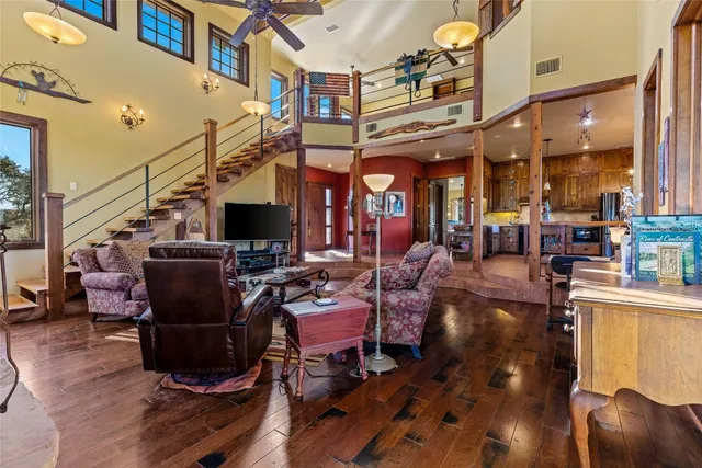 a living room with lots of furniture and a flat screen tv