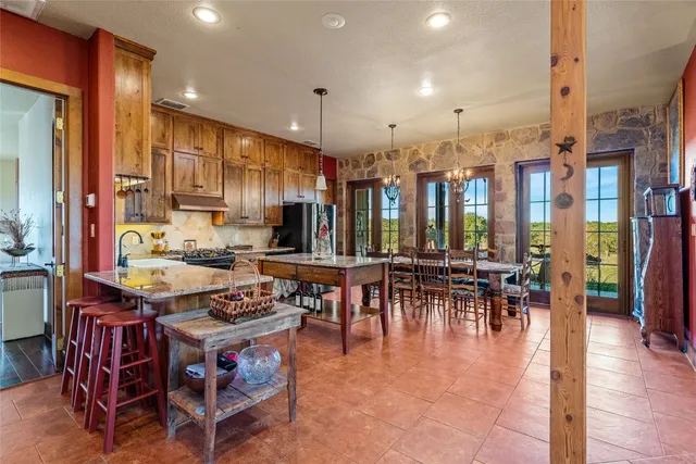 a kitchen with lots of counter top space and stainless steel appliances