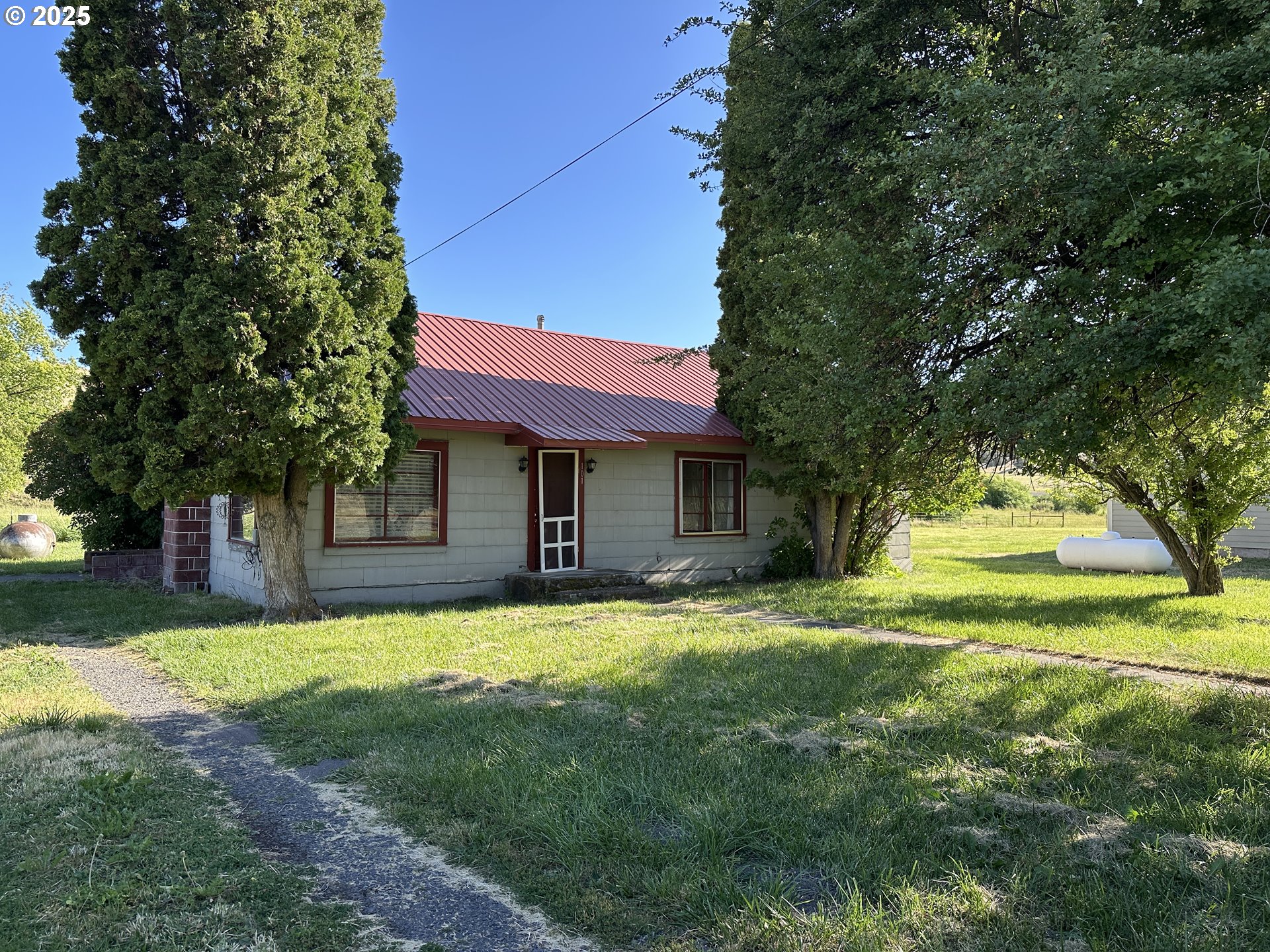 101 First Street Fossil, OR 97830 - Photo 1 of 13 a view of a house with a yard