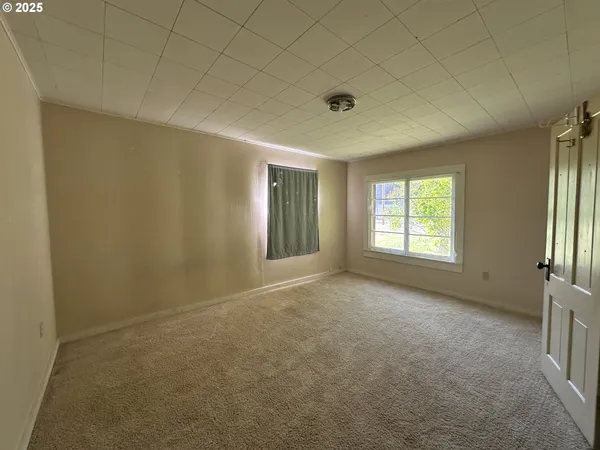 an empty room with windows