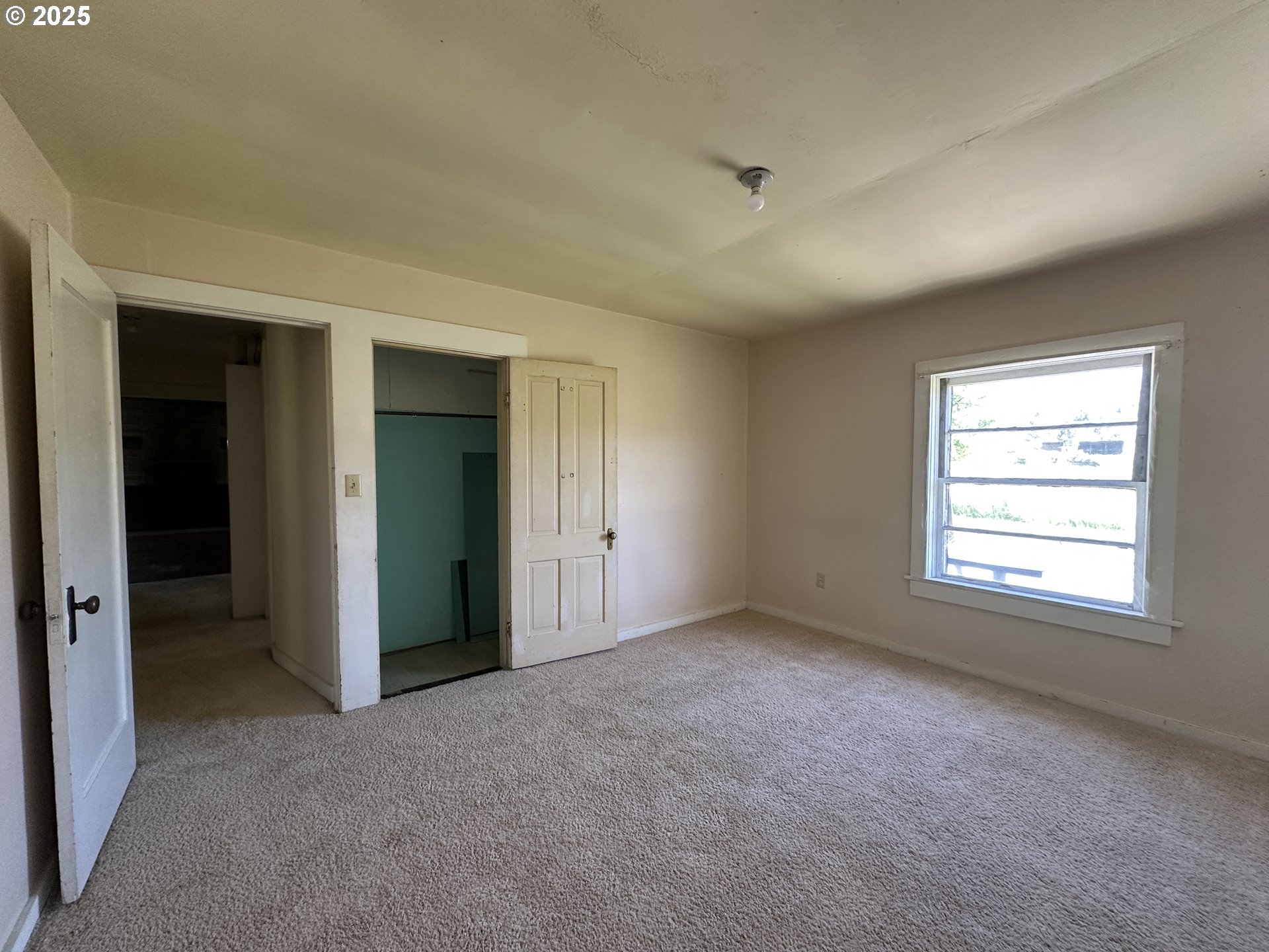101 First Street Fossil, OR 97830 - Photo 5 of 13 an empty room with windows and closet