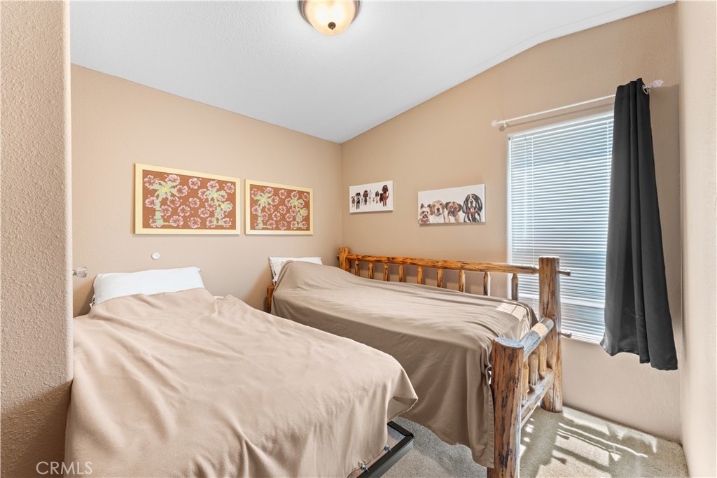 5900 Colorado River Road, Unit 18 Blythe, CA 92225 - Photo 26 of 58 a bedroom with a bed and a large window