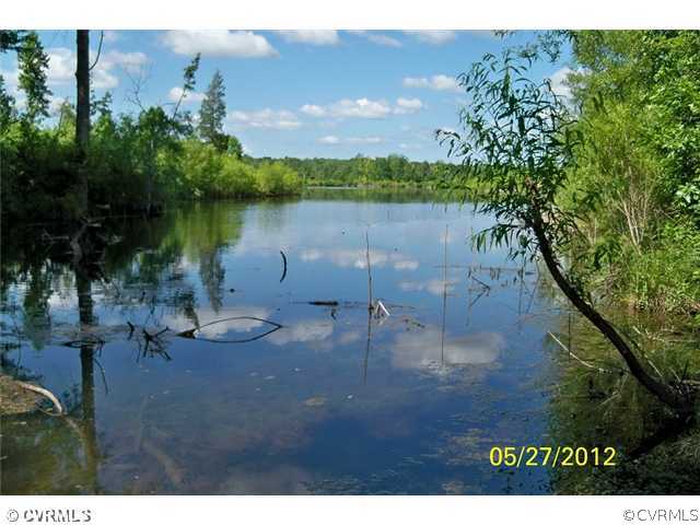 291 Mountain Hall Road Crewe, VA 23930 - Photo 12 of 12 a view of a lake with outdoor space