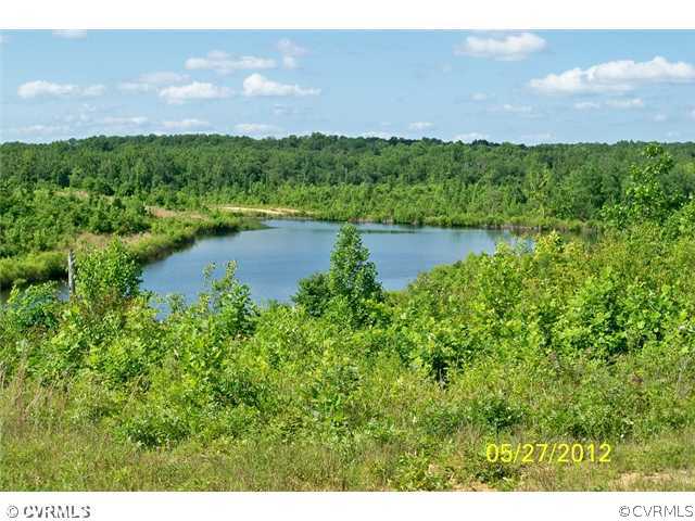291 Mountain Hall Road Crewe, VA 23930 - Photo 3 of 12 a view of a lake and green valley