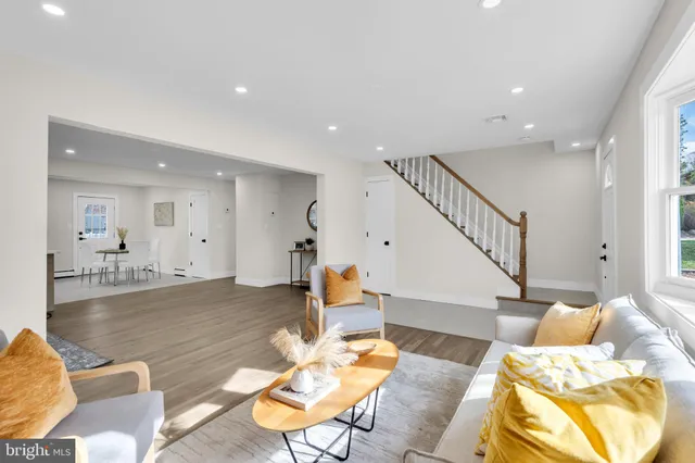 a living room with furniture and a table