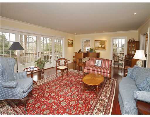 69 St Nicholas Road Darien, CT 06820 - Photo 4 of 20 a living room with furniture and a floor to ceiling window