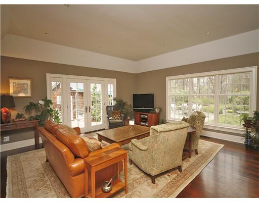 69 St Nicholas Road Darien, CT 06820 - Photo 10 of 20 a living room with fireplace furniture and a large window