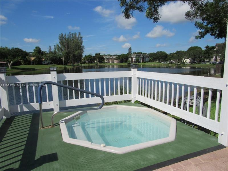 3730 Inverrary Drive, Unit 2P Lauderhill, FL 33319 - Photo 35 of 41 a view of balcony with wooden floor and outdoor seating