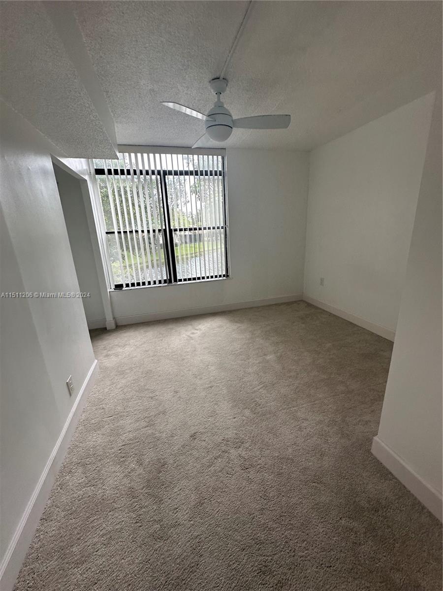 3730 Inverrary Drive, Unit 2P Lauderhill, FL 33319 - Photo 8 of 41 a view of an empty room with a window