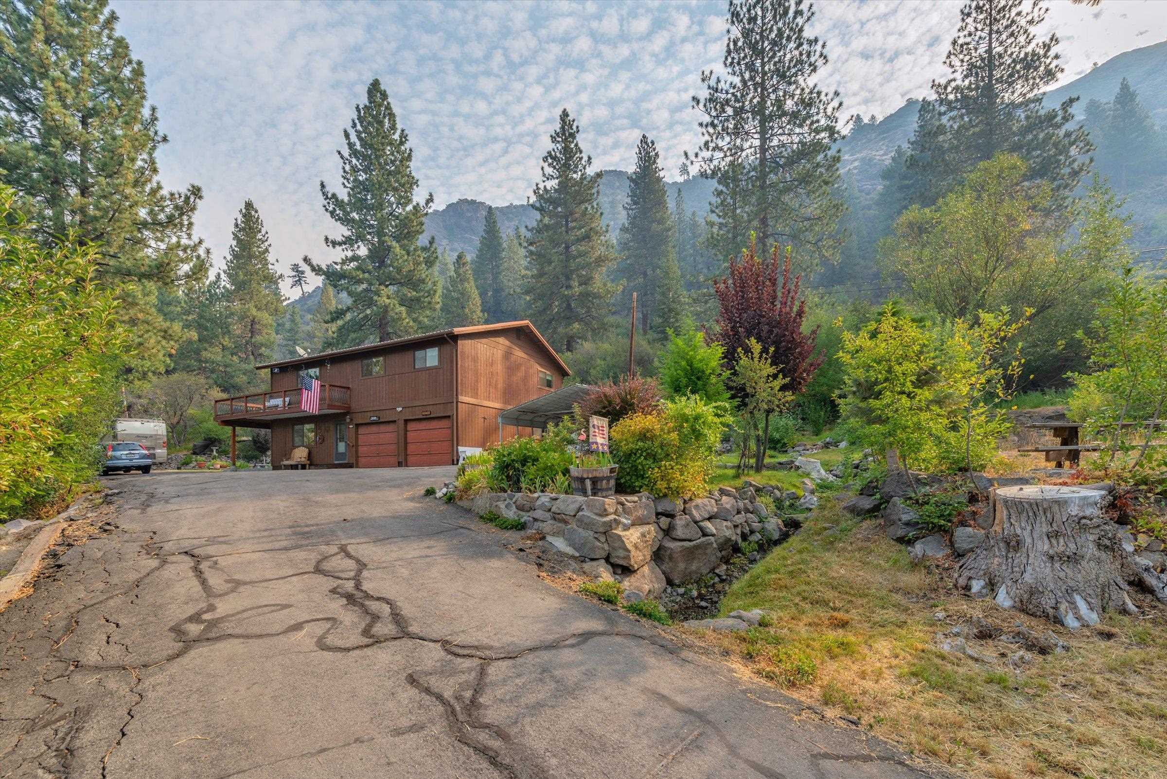 a pathway of a house with a yard