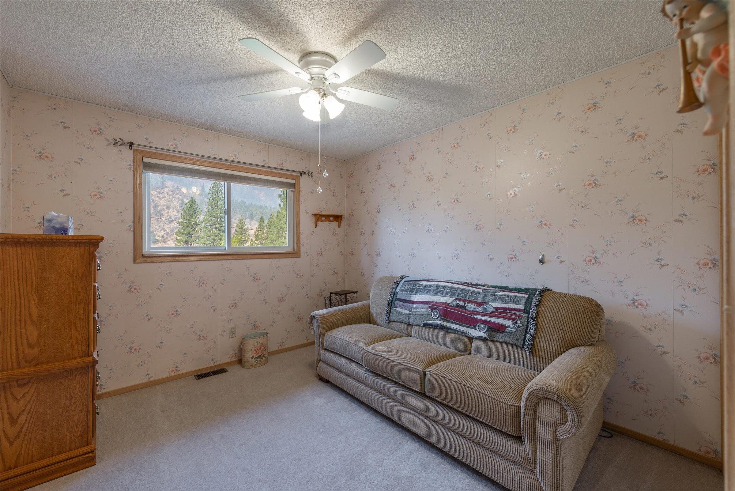 10341 Pine Way Floriston, CA 96111 - Photo 17 of 21 a living room with furniture and a chandelier