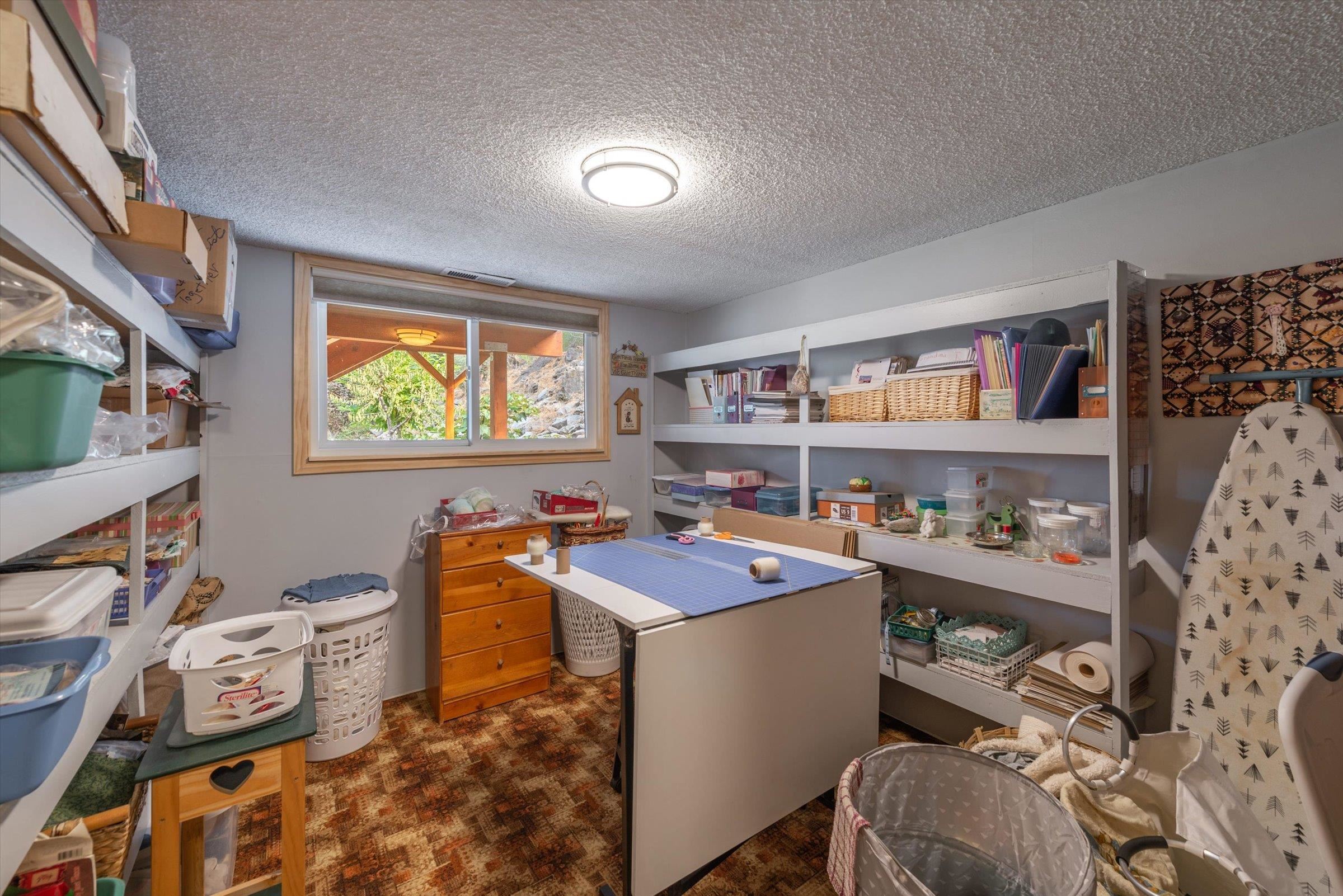 10341 Pine Way Floriston, CA 96111 - Photo 18 of 21 a room with furniture a rug toys and a window