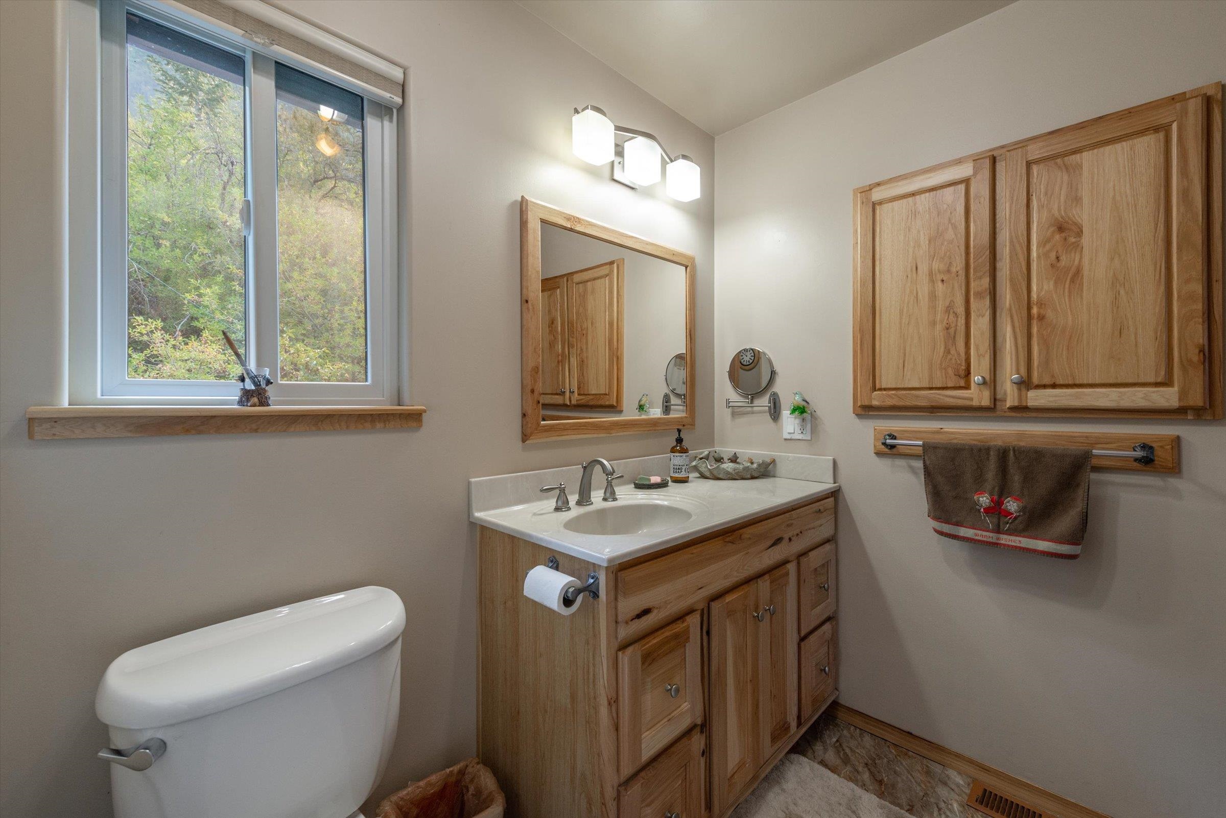 10341 Pine Way Floriston, CA 96111 - Photo 20 of 21 a bathroom with a toilet a sink and a mirror