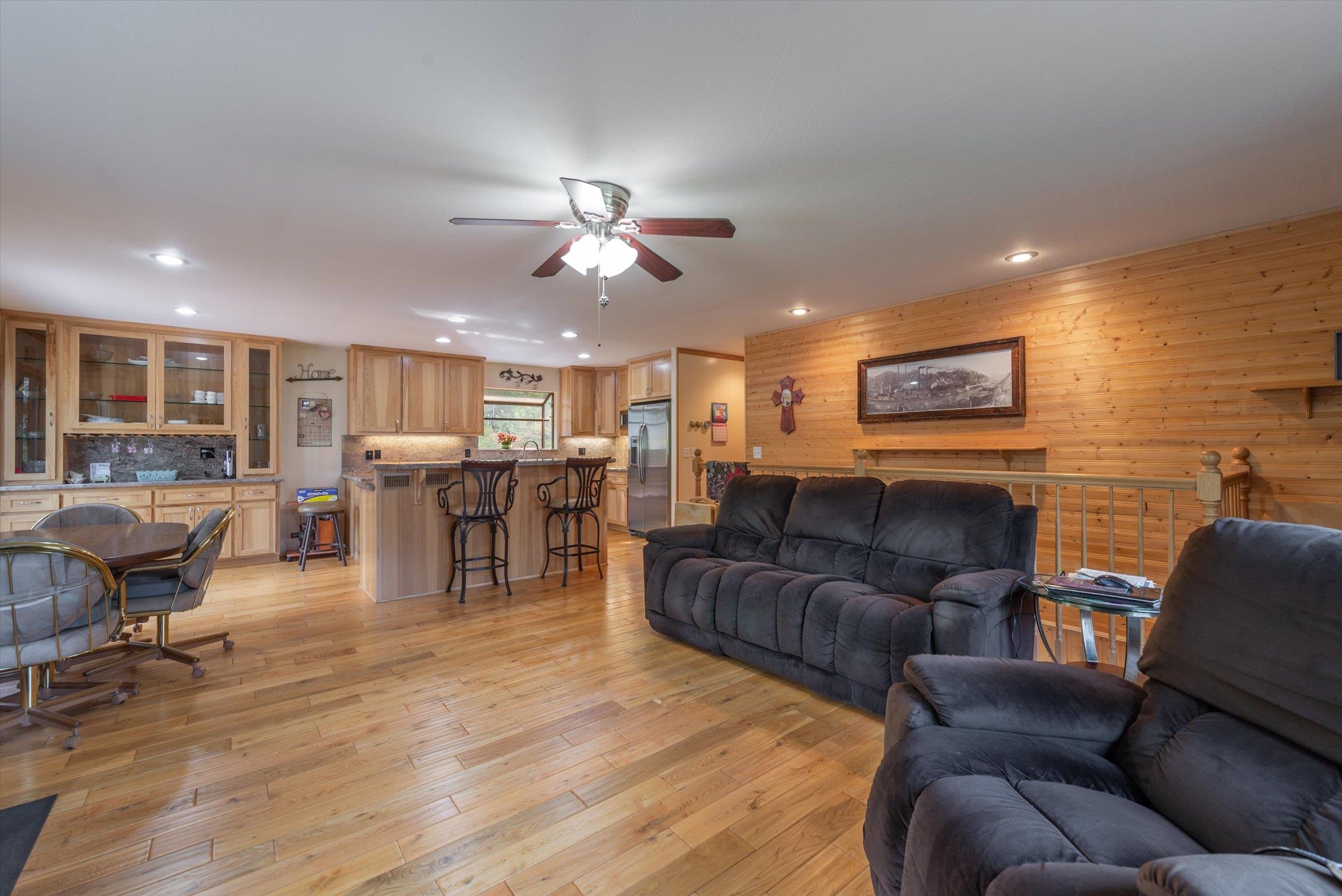 10341 Pine Way Floriston, CA 96111 - Photo 5 of 21 a living room with furniture kitchen view and a wooden floor