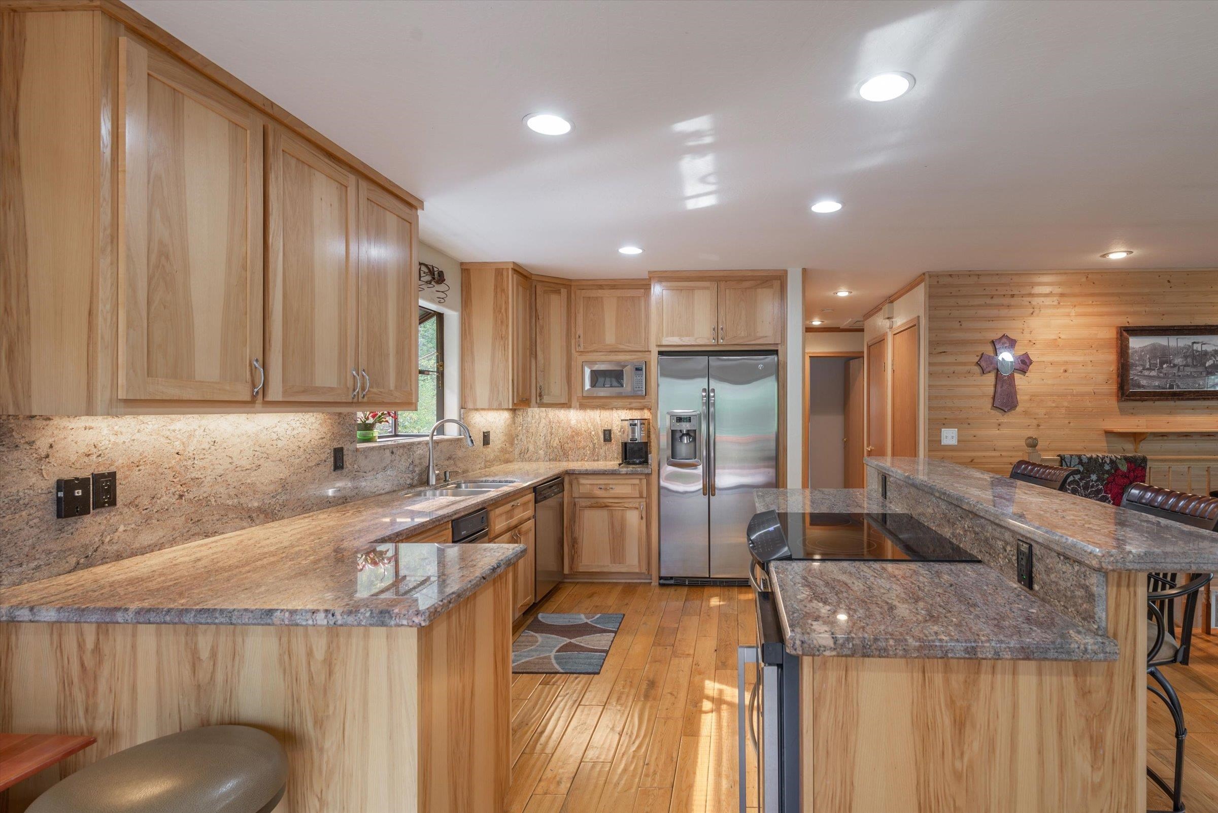 10341 Pine Way Floriston, CA 96111 - Photo 9 of 21 a kitchen with counter top space cabinets and stainless steel appliances