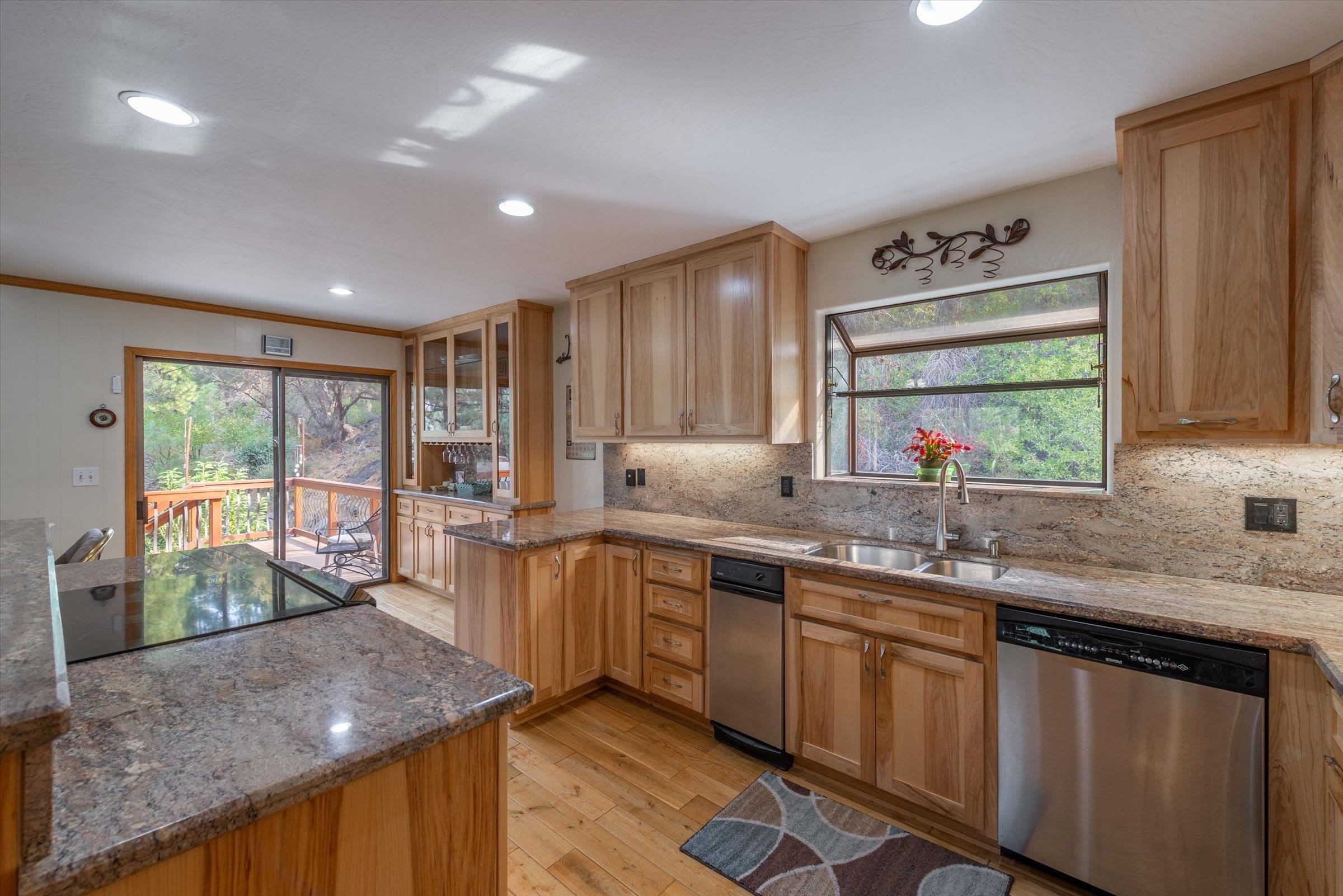 10341 Pine Way Floriston, CA 96111 - Photo 10 of 21 a kitchen with stainless steel appliances granite countertop sink stove and cabinets